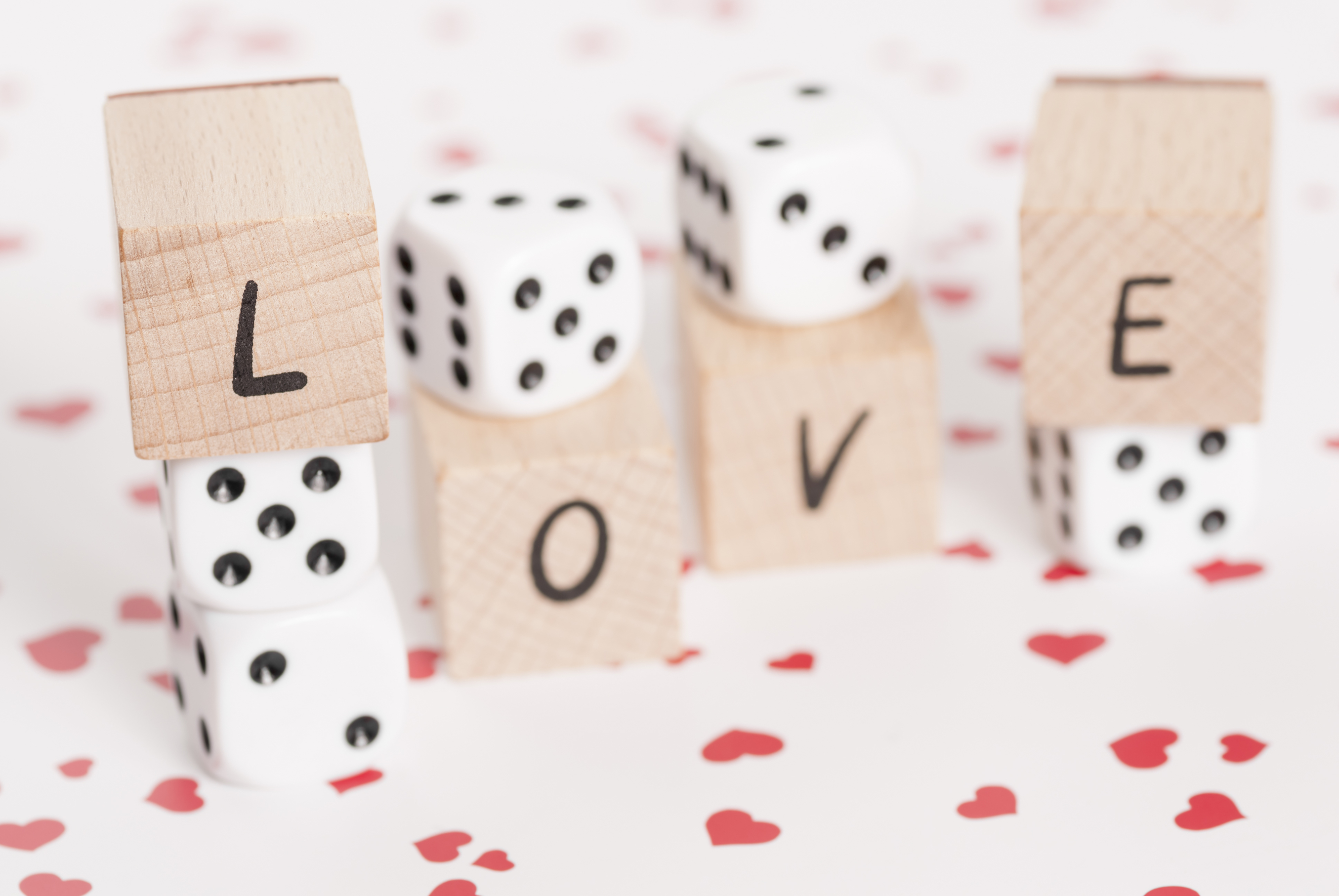 Love and Dice on Heart Background.